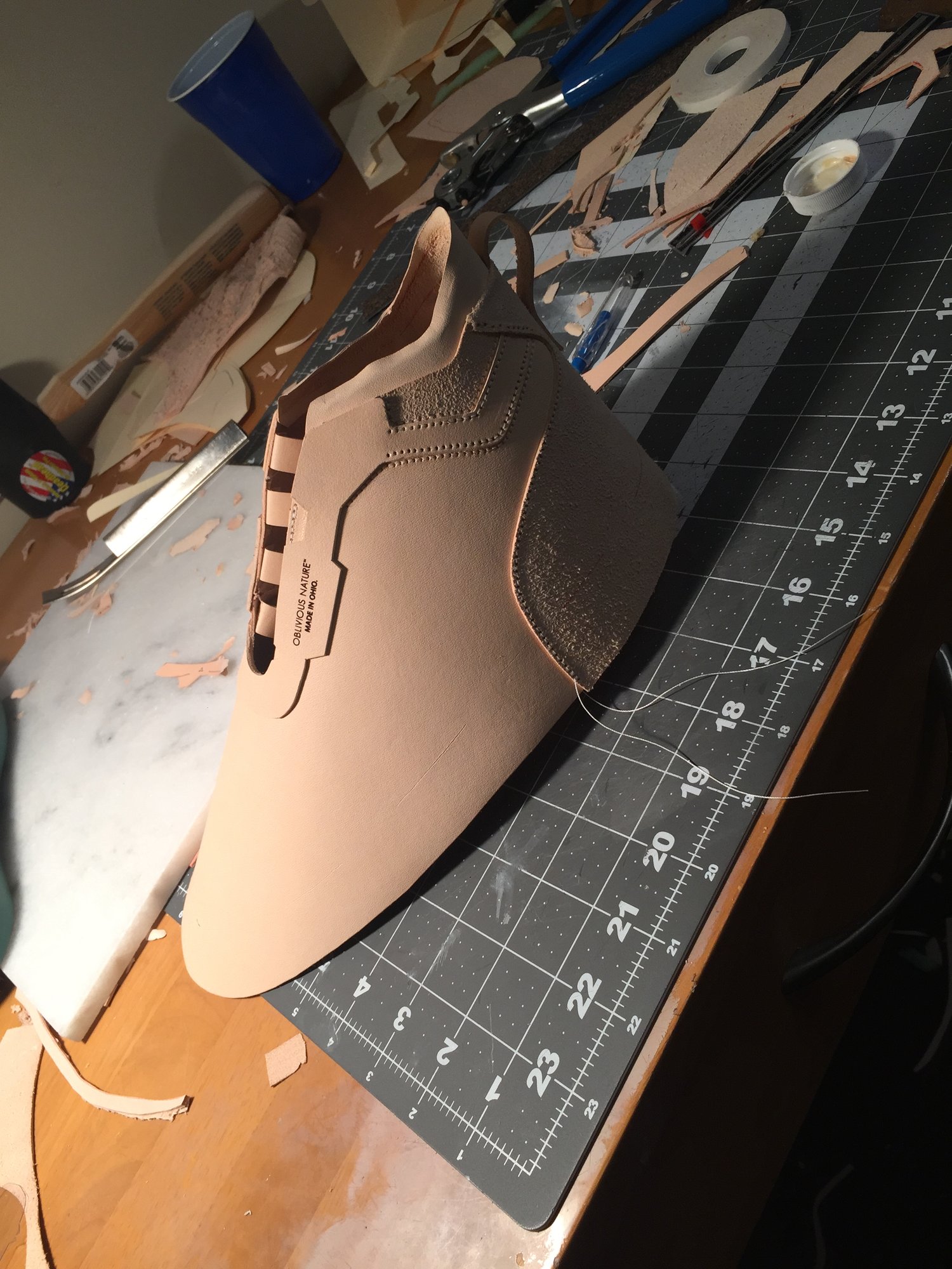 Stitched leather shoe upper mid-construction